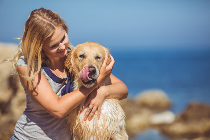 Beautiful-woman-with-her-dog-playing_59203805_XS